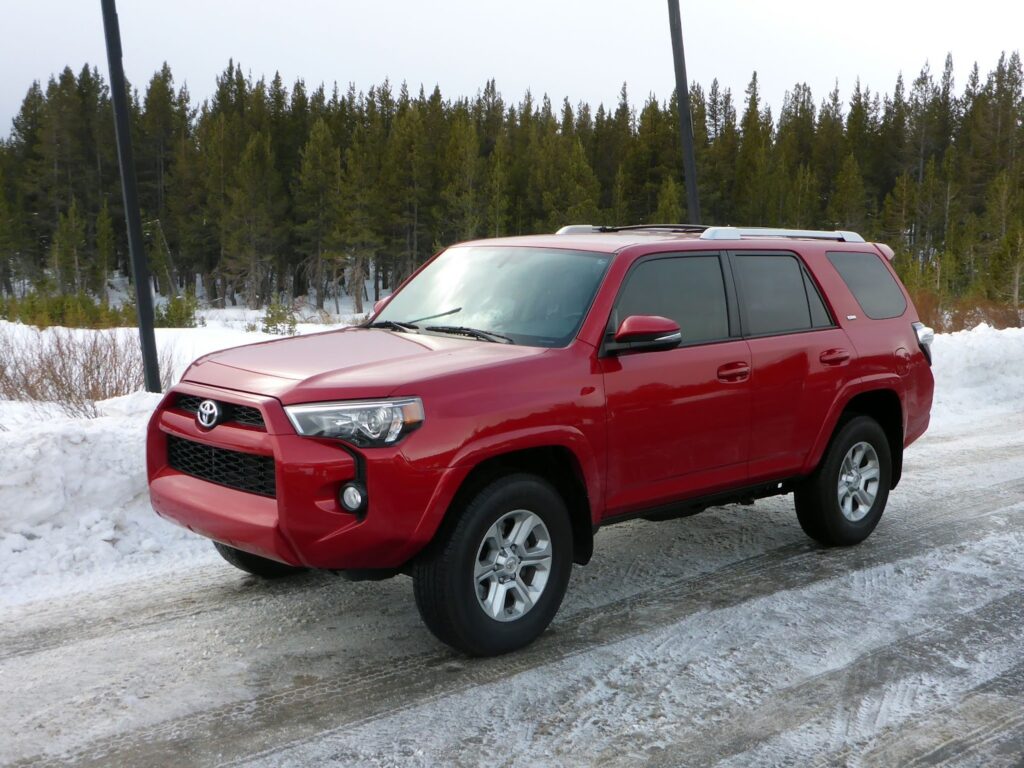 Red Toyota 4Runner with rough country lift kit